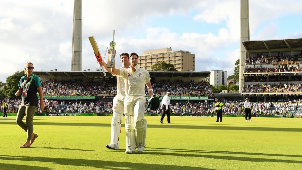 Unbeaten: Mitchell Marsh and Steve Smith leave the field at stumps at the WACA.