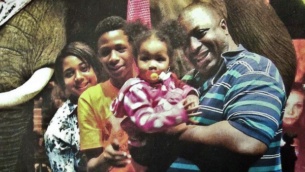 An undated photo of Eric Garner with his family. 