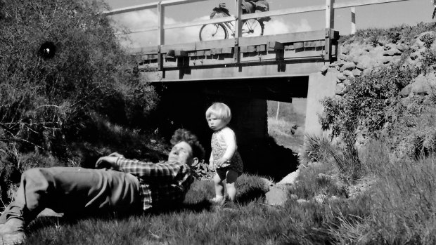 Erwin Feeken and daughter Sygun,14 months, at a roadside camp at Colinton, near Bredbo in 1956.