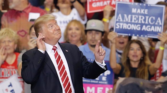 As the rally dragged on into the night, many in the crowd lost interest in what the President was saying.