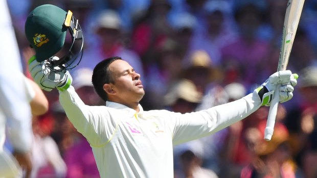 Man of the moment: Usman Khawaja takes in the feat of a century on his old home ground.
