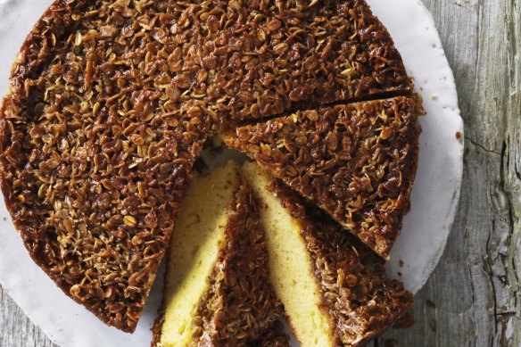 Butter cake with a golden Anzac biscuit topping.