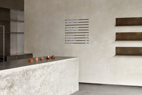 The store features many of Lune's design signatures, such as a minimalist aesthetic and poured concrete surfaces.