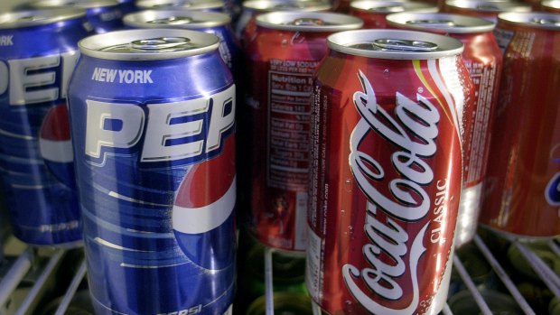 The soft drink makers said they will expand the presence of low- and no-calorie drinks and encourage consumerso reduce the calories they are drinking.