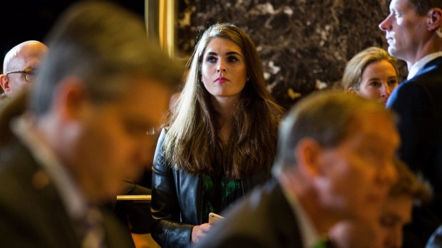 Hope Hicks watches from the sidelines at a Donald Trump press conference.