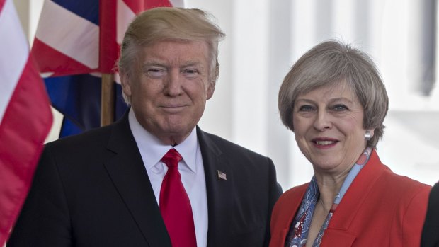 British PM Theresa May says Donald Trump's state visit to the UK will go ahead.