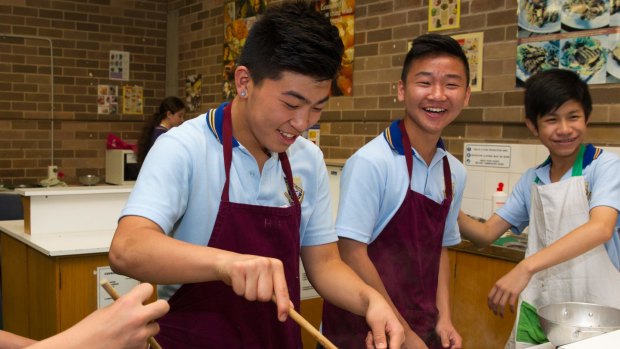 St Johns Park High School students, from left, Damien Lie, Simon Hua and Tommy Le.
