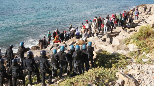 Migrants in a standoff with Italian police officers after the evacuation of a tent camp in Ventimiglia, on the Franco-Italian border, last year.