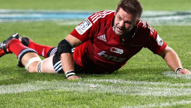 Down and out:  Richie McCaw is concussed against the Blues.