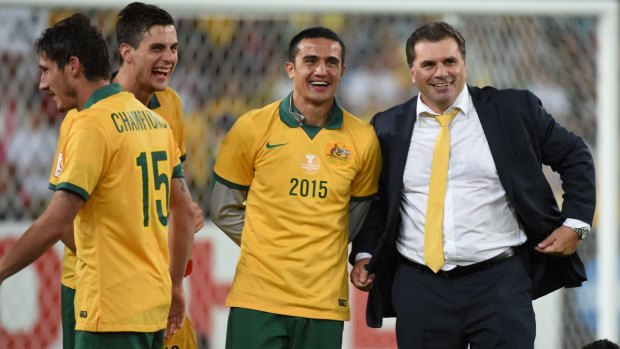 Trusted mentor: Ange Postecoglou with his victorious players.