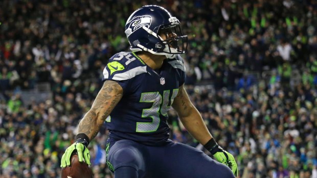 Seahawks running back Thomas Rawls celebrates after he rushed for a touchdown.