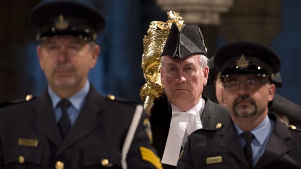 Ceremonial role: Sergeant-at-Arms Kevin Vickers carries the mace through the Hall of Honour during the Speakers parade in the House of Commons in Ottawa. 