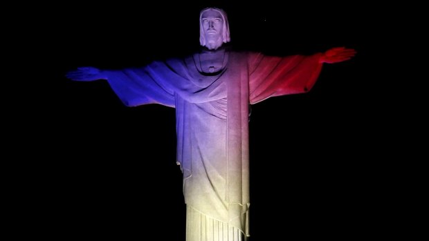 The statue of Christ the Redeemer is lit up in France's official colours in Rio, Brazil, to celebrate the Bastille Day.
