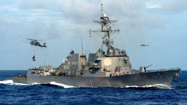 The USS Dewey conducted a "man overboard" exercise near Mischief Reef on Thursday. 
