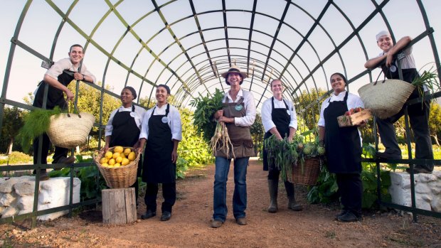 Babylonstoren chefs parading with morning's harvest.