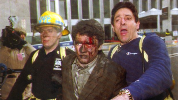 New York City rescue personnel help an injured businessman away from the 1993 World Trade Centre attack.