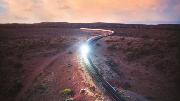 The Indian Pacific heading towards Broken Hill at dawn.