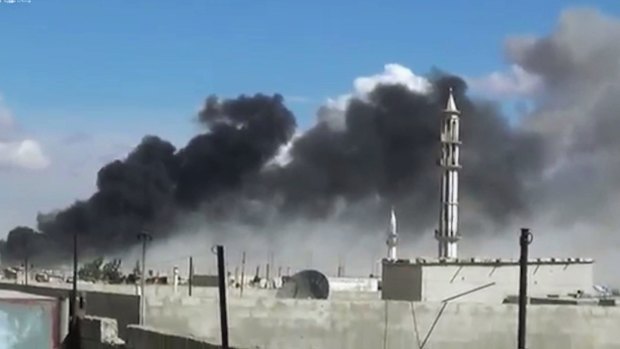Smoke rises after air strikes by military jets in Talbiseh in the Homs province, western Syria, after Russian military jets carried out air strikes for the first time.