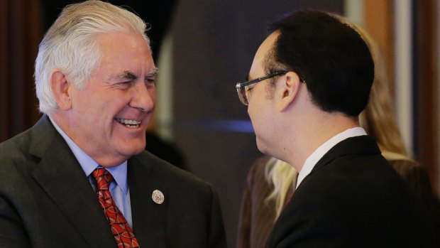 US State Secretary Rex Tillerson, left, is greeted by Philippine Foreign Affairs Secretary Allan Peter Cayetano in Manila.