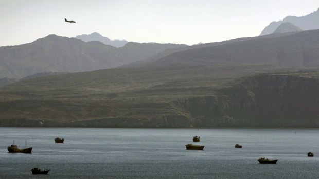 A plane flies over the mountains south of the Strait of Hormuz in 2012. 