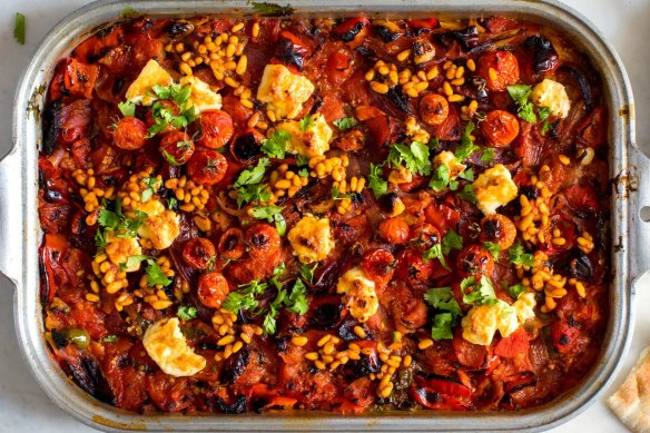 Charred tomatoes with feta and harissa pine nuts, a dish inspired by North African salads.