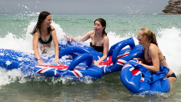 Lizzie Kroeze, Isobel Owens and Lauren Vanstone celebrate Australia Day at Bondi Beach.