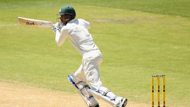 Back in the runs: Mitchell Starc sets off during his innings of 53 in Adelaide.