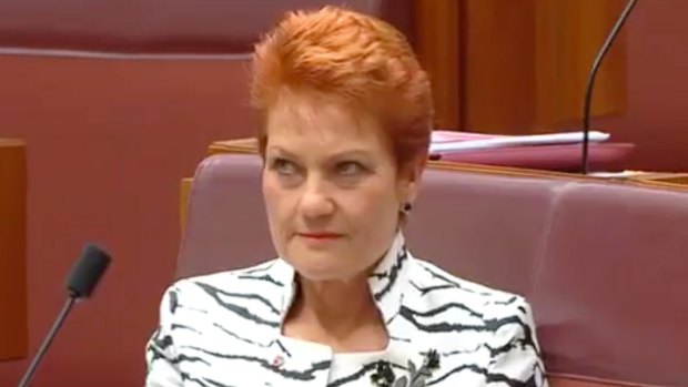 Pauline Hanson rolls her eyes during the maiden speech by One Nation Senator Malcolm Roberts.
