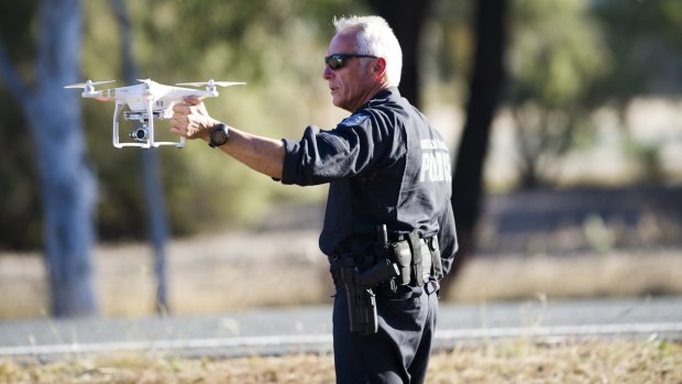 An AFP officer with a police drone.
