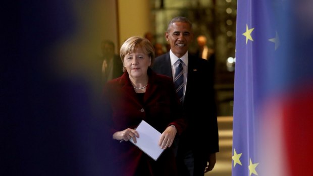 German Chancellor Angela Merkel and US President Barack Obama arrive for their joint press conference in Berlin.