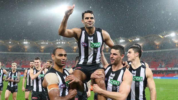 Collingwood's Daniel Wells  is chaired the field after his 250th match, which turned out to be a nail-biting 15-point win over Gold Coast.
