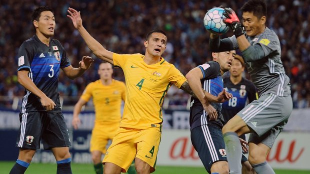Contained: Tim Cahill can't find any joy in front of goal.