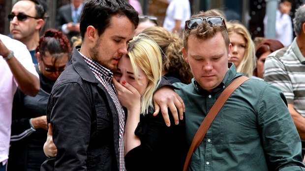 As floral tributes filled Martin Place, people arrived to grieve the lives lost in the siege. 