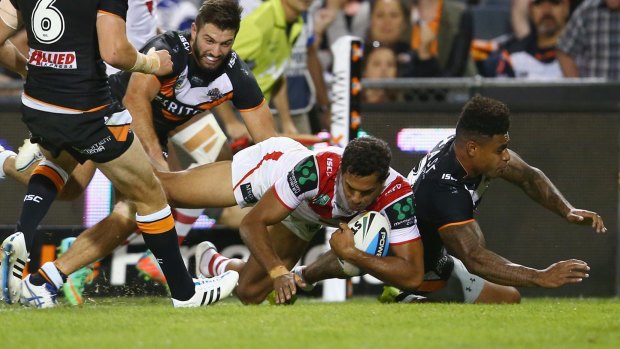 Rare sight: Dane Nielsen crosses for a try against Wests Tigers on Monday night.