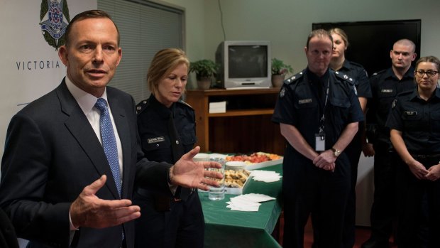 Former prime minister Tony Abbott discusses counter terrorism with Victoria Police and the AFP at Endeavour Hills Police Station in Melbourne in June.
