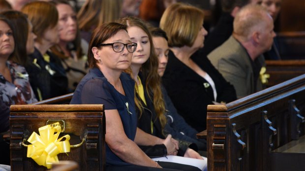 In grief ... Barbara Henning (centre)), the wife of murdered British aid worker Alan Henning, and their daughters, attend a quiet service of remembrance for Mr Henning in Eccles Parish Church in north-west England.
