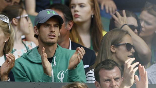 Andy Murray and wife Kim watch on.