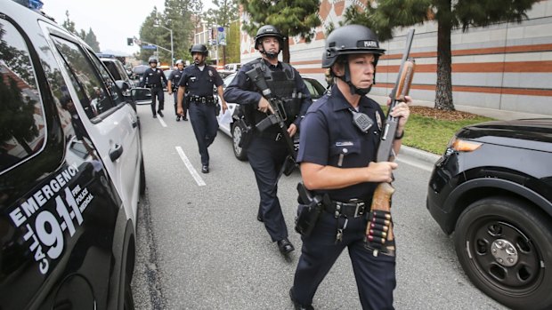 Police officers at the scene of a fatal shooting.