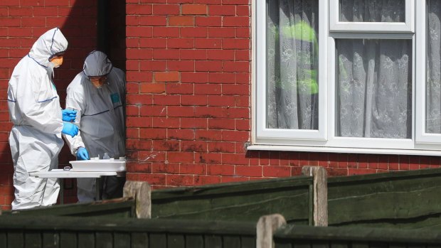 Police forensic investigators search a Fallowfield, Manchester  property linked to the Abedi family.