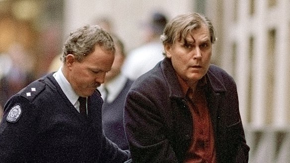 Bandali Debs is led from a prison van at the Supreme Court on June 24, 2002.