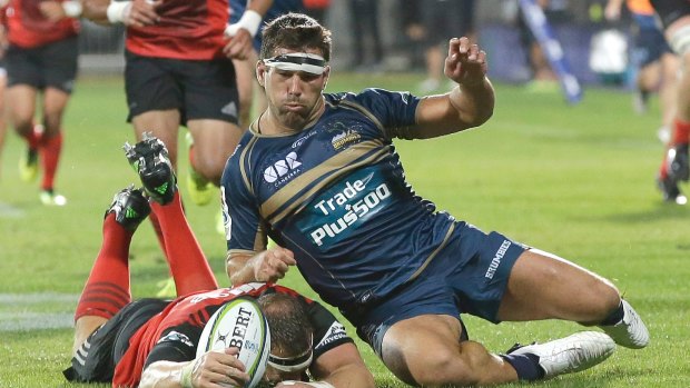 Brumbies Chris Alcock, right, and Crusaders Wyatt Crockett compete for the ball during their Super 15 rugby match in Christchurch, New Zealand, Saturday, Feb. 25, 2017. (AP Photo/Mark Baker)