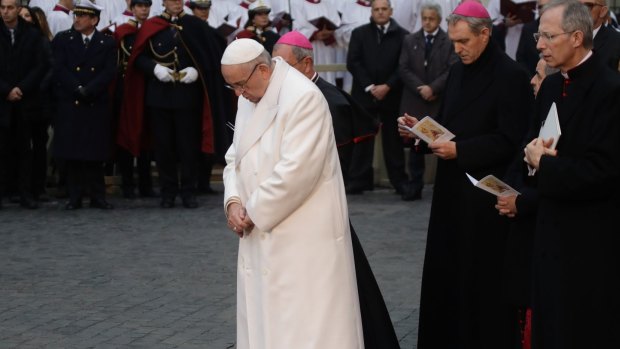 Pope Francis prays in front of the statue of the Virgin Mary, near Rome's Spanish Steps .