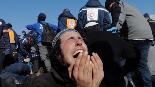 A settler reacts as police evict the last settlers from the West Bank outpost of Amona on Thursday.
