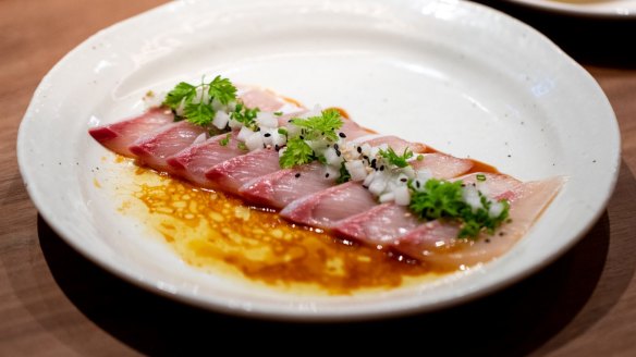 Kingfish, truffle ponzu, pickled daikon, chives. 