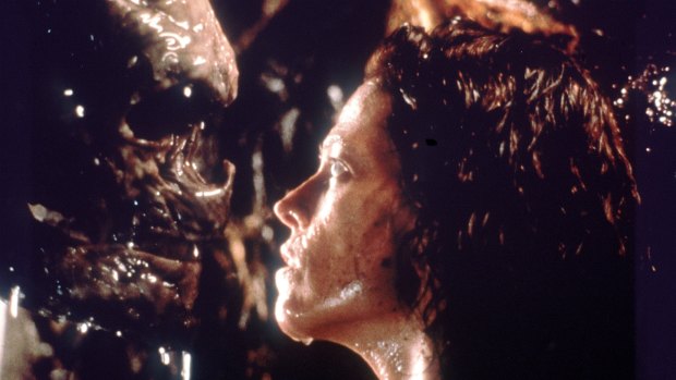 Sigourney Weaver eyes her alien adversary, which might be female, in the Alien series.