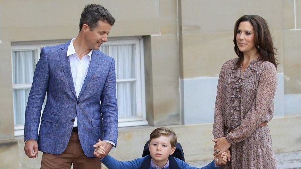 Prince Frederik and Princess Mary of Denmark pose with their son Prince Christian.