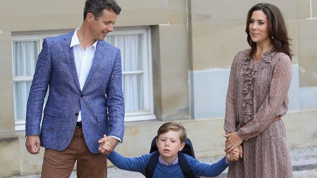 Prince Frederik and Princess Mary of Denmark pose with their son Prince Christian.