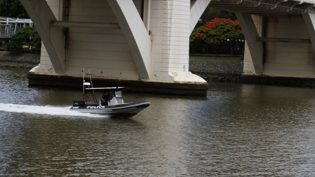 Police continue to search the Brisbane River for a missing British traveller.