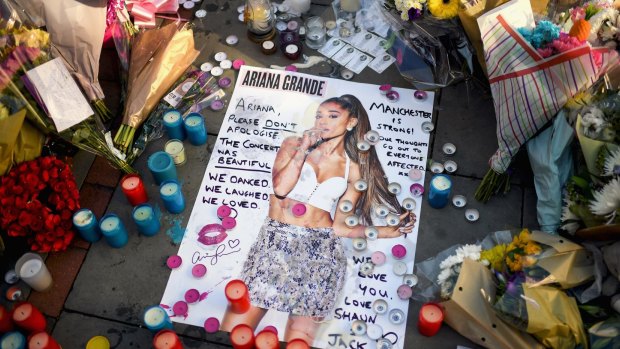 Tributes left in St Ann's Square for the people who died in Monday's terror attack at the Manchester Arena.