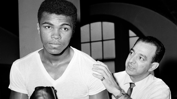 Muhammad Ali, or Cassius Clay as he was known in this 1962 photograph with his trainer Angelo Dundee. Clay would change his name two years later. 